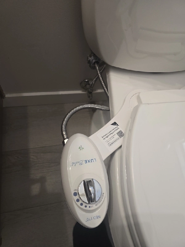 Bidet seat cover installation during a Syracuse residential plumbing upgrade
